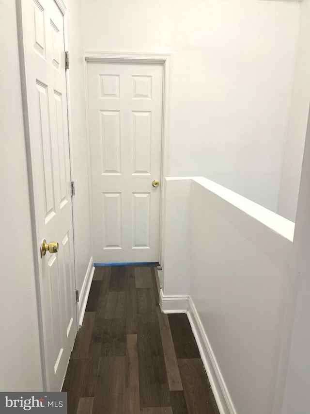 hall with dark hardwood / wood-style floors