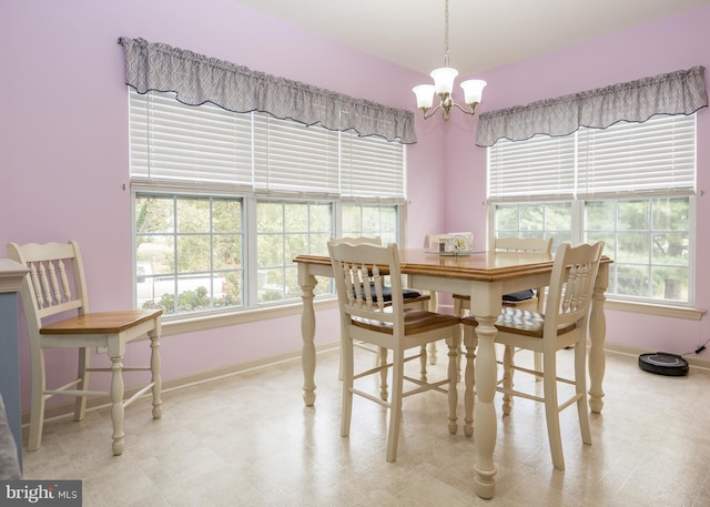 dining room featuring a wealth of natural light and a chandelier