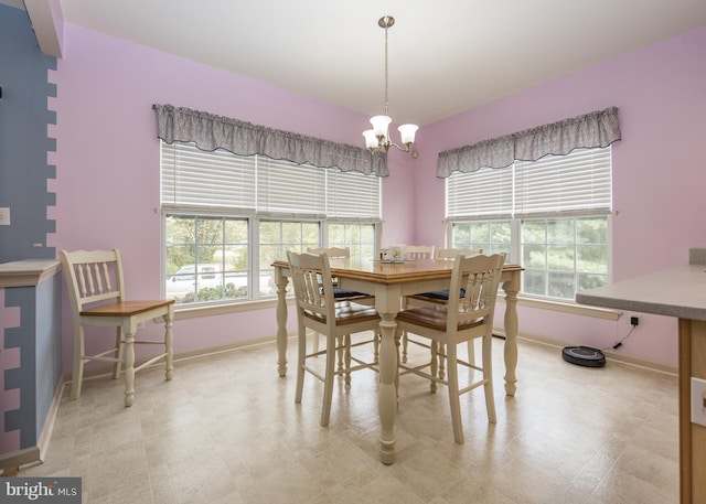 dining space with a chandelier and a wealth of natural light