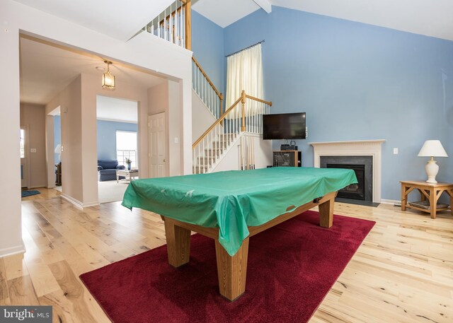 rec room featuring pool table, wood-type flooring, and high vaulted ceiling