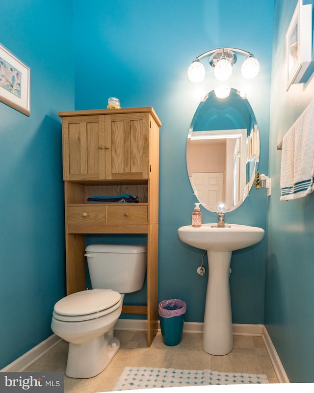 bathroom with tile patterned flooring and toilet