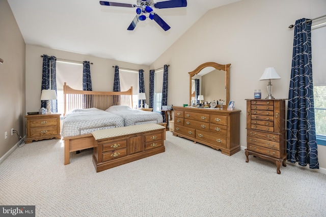 carpeted bedroom with vaulted ceiling and ceiling fan