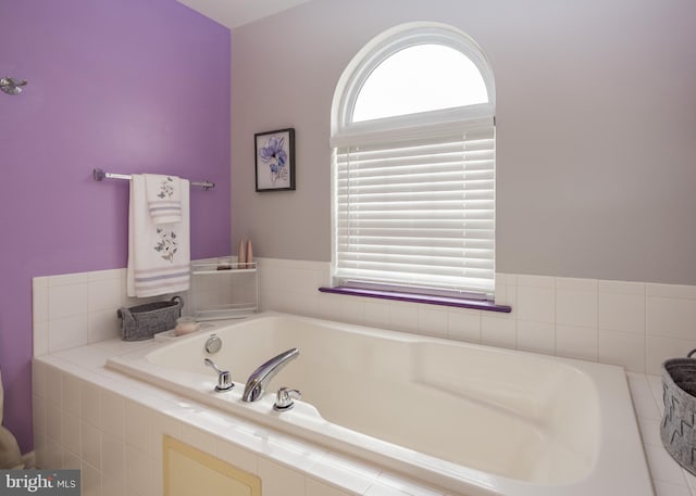 bathroom with tiled tub