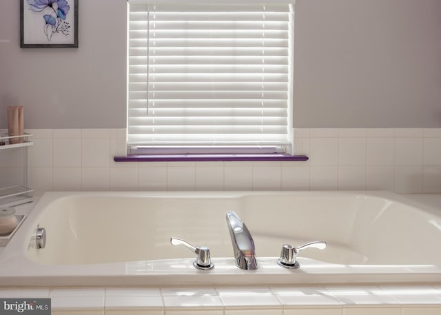 bathroom with a relaxing tiled tub