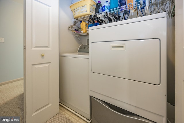 laundry room featuring washer / dryer