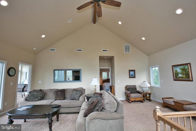 carpeted living room featuring high vaulted ceiling, beam ceiling, and ceiling fan