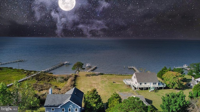 birds eye view of property featuring a water view