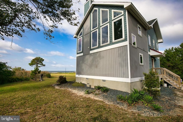 view of home's exterior featuring a yard