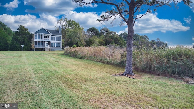 view of yard featuring a sunroom