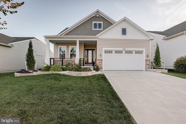 craftsman-style home featuring a porch, a front lawn, and a garage