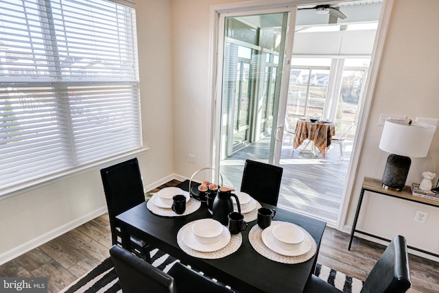 dining room featuring hardwood / wood-style floors, ceiling fan, and plenty of natural light