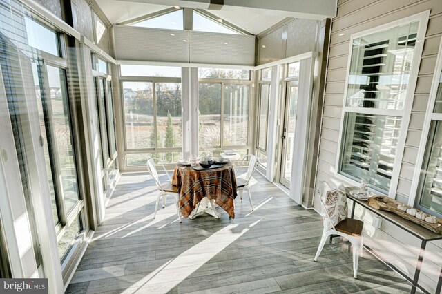 sunroom / solarium with vaulted ceiling and a wealth of natural light