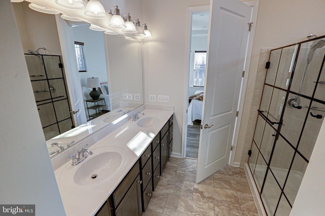 bathroom with vanity and a shower with shower door