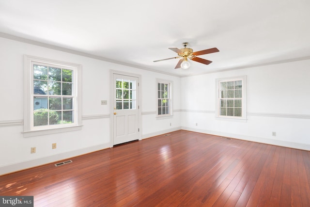 spare room with ceiling fan, dark hardwood / wood-style floors, and crown molding