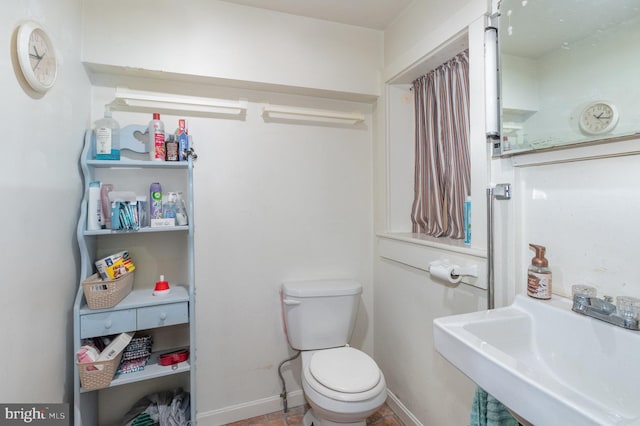 bathroom with sink and toilet