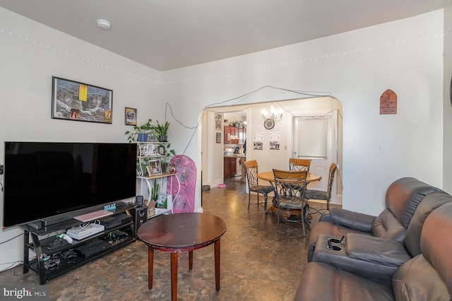 living room featuring an inviting chandelier