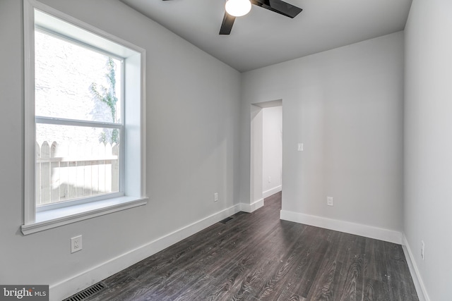 unfurnished room featuring ceiling fan and dark hardwood / wood-style flooring