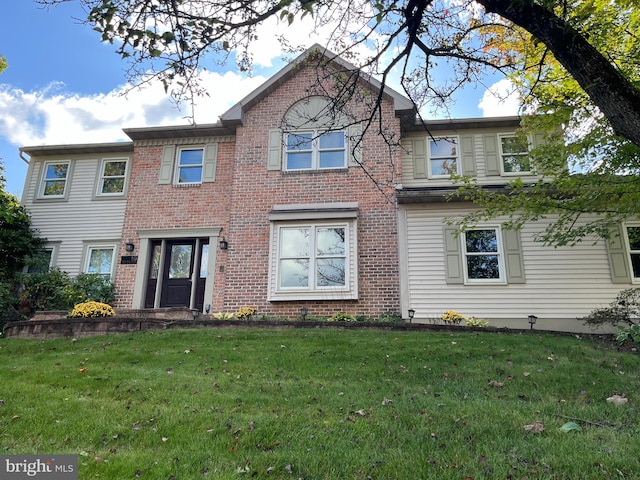 view of front of home featuring a front yard