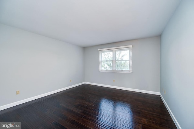 spare room featuring hardwood / wood-style floors