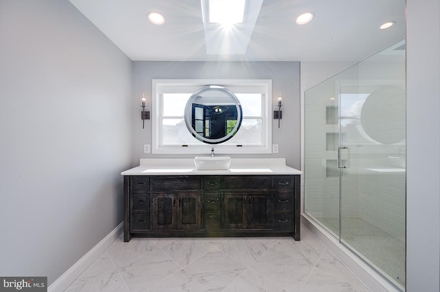 bathroom featuring an enclosed shower and vanity