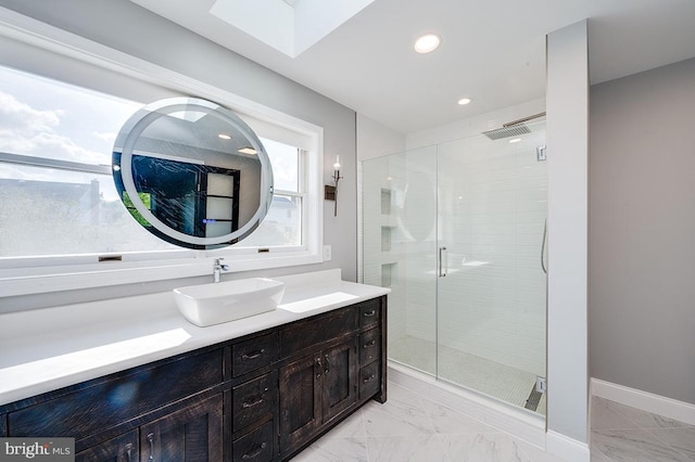 bathroom featuring vanity and a shower with shower door