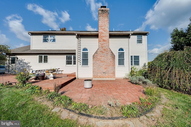 back of property featuring a patio