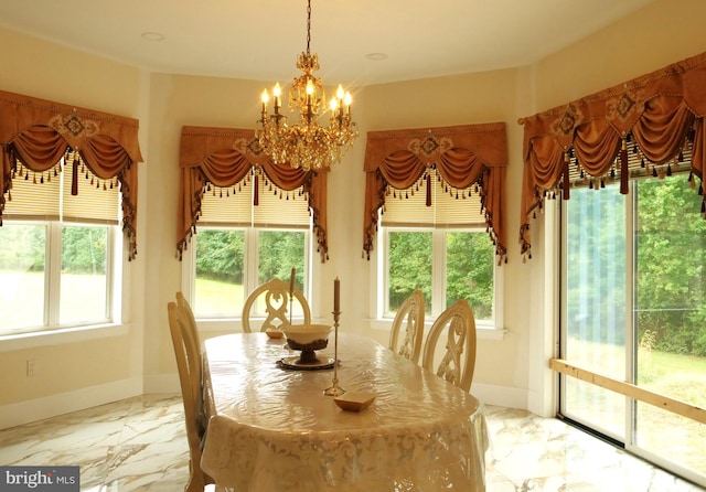 dining space featuring a notable chandelier