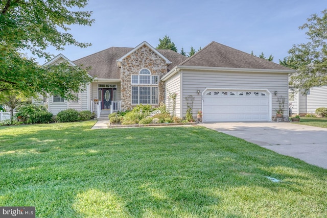 view of front of house with a garage and a front lawn