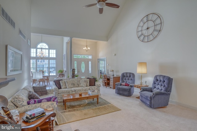 living room featuring ceiling fan with notable chandelier, high vaulted ceiling, and carpet floors