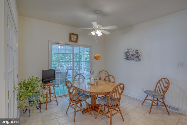 dining space featuring ceiling fan