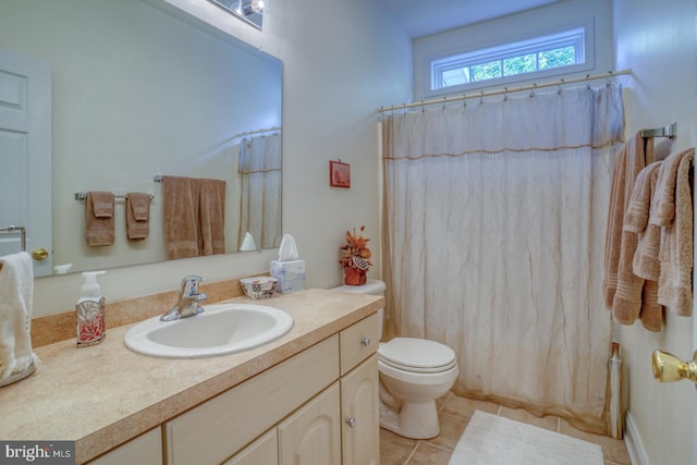 bathroom with walk in shower, tile patterned flooring, vanity, and toilet