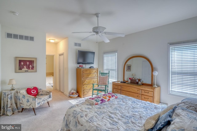 carpeted bedroom with ceiling fan