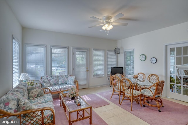 living room with ceiling fan and light colored carpet