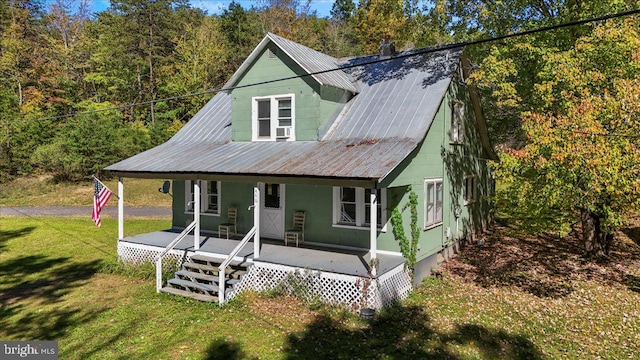 view of front of home with a front lawn and a porch