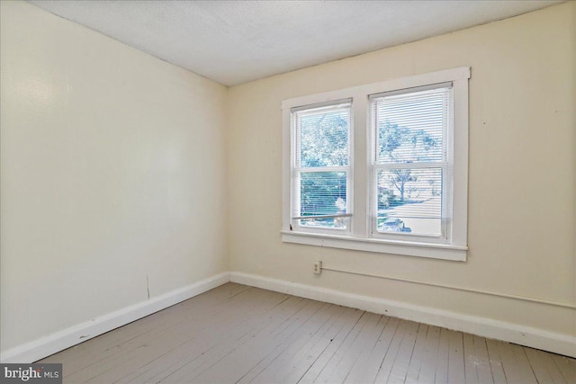 empty room with light hardwood / wood-style floors