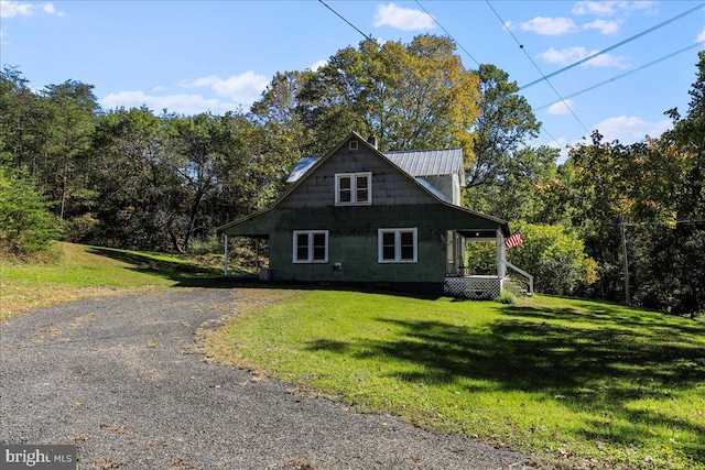 view of home's exterior with a yard