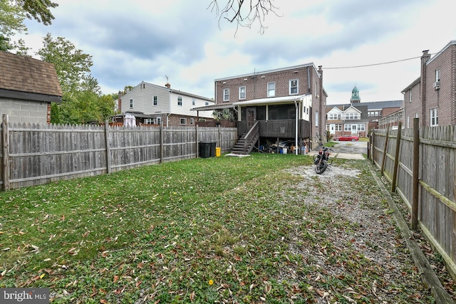 view of yard with a sunroom