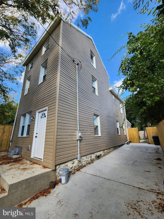 view of property exterior featuring a patio