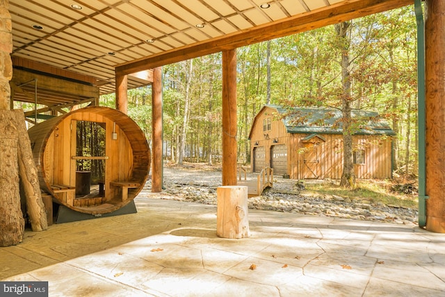 view of patio / terrace with a shed