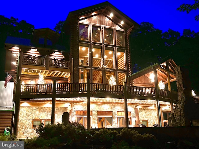 back house at night with a balcony