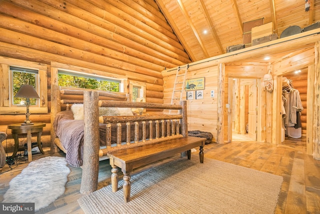 bedroom with multiple windows, hardwood / wood-style flooring, wooden ceiling, and log walls