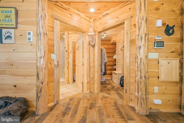 hallway with hardwood / wood-style floors