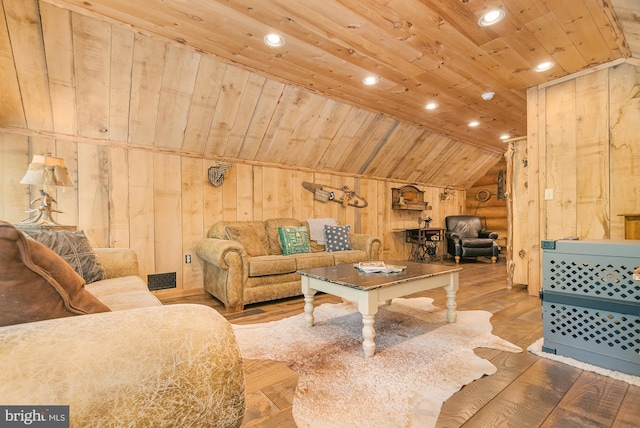 living room with wood-type flooring, wood walls, wooden ceiling, and vaulted ceiling