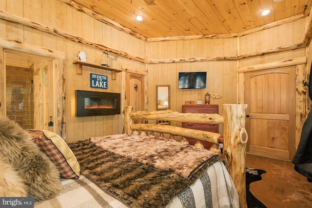 bedroom featuring wooden walls and wood ceiling