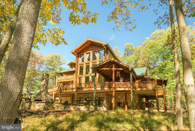 rear view of house with a deck