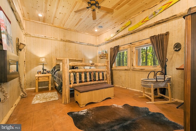 bedroom with wooden walls and wooden ceiling