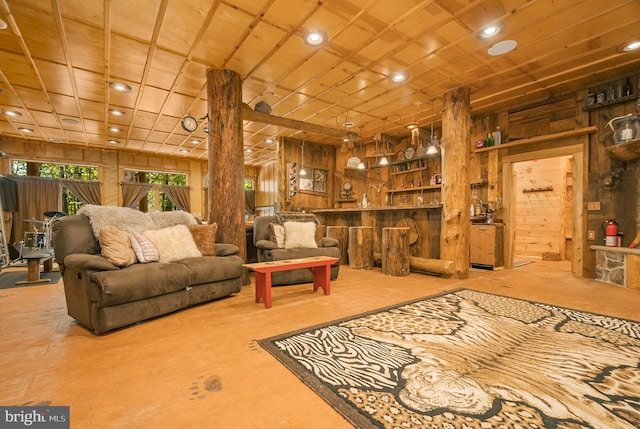 interior space featuring wooden walls and indoor bar