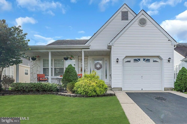 view of front facade with a front lawn and a garage