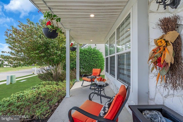 view of patio featuring a porch