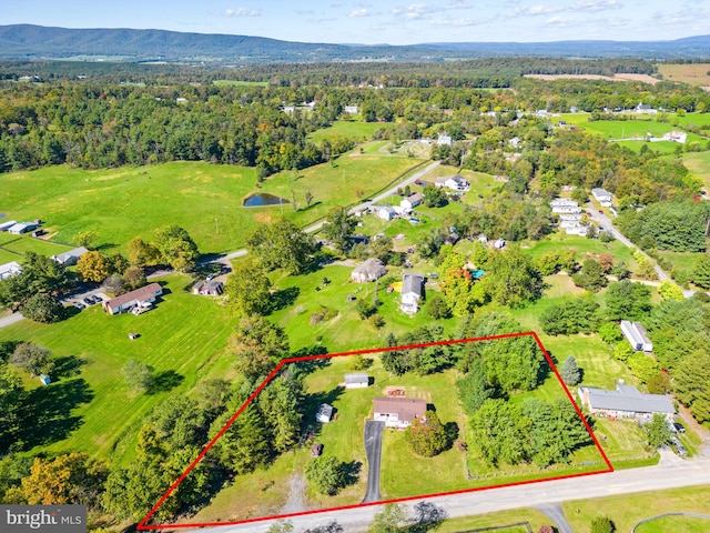 birds eye view of property featuring a mountain view